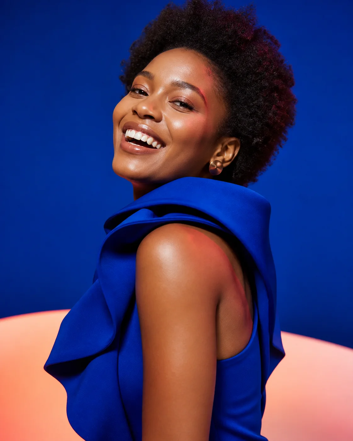 Adult Black woman in a vivid cobalt studio fashion portrait
